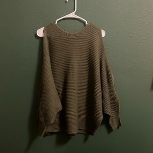 oversized green sweater with shoulder and arm slit